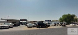 Open yard area of 20,000 sq. ft with boundary wall for storage, parking or equipment – Al Muqta area.
