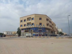 Building for sale in Ajman, Al Rawda 1, in a vital location at the corner of two streets
