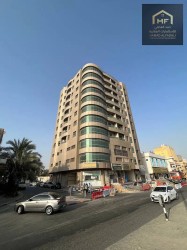 For sale, a distinctive building on a main street, a vital location in Al Nuaimiya area, Ajman