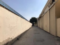 Industrial area for sale in Ajman, area 40,000 square feet, consisting of workers’ housing + warehouses + commercial shops, fully rented, freehold for
