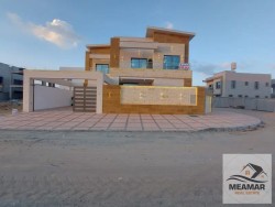 Villa for sale in Ajman, corner of two streets, stone face, directly on a neighbor street, with the possibility of easy bank financing without down pa